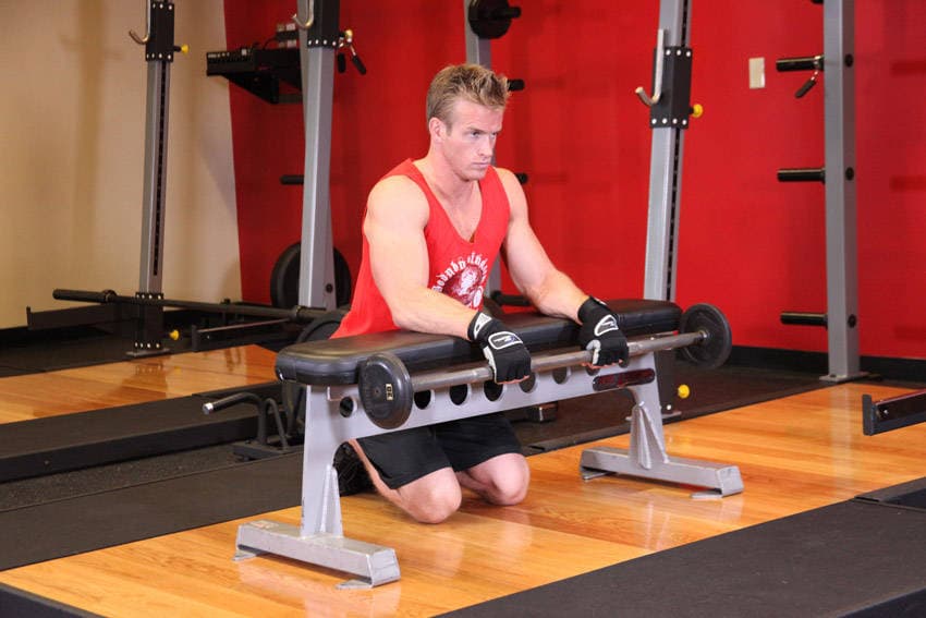 Palms-Down Wrist Curl Over A Bench